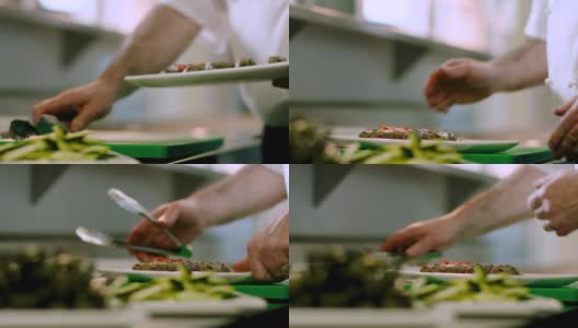 在一家餐馆里，厨师用盘子盛着一些刚烤好的羊肉串高清在线视频素材下载
