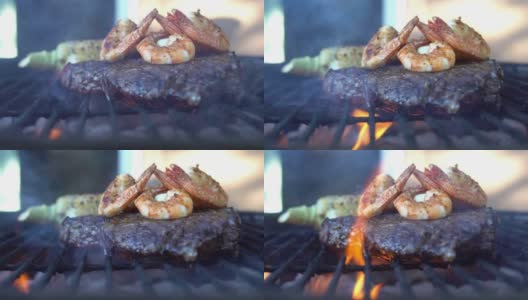 肋眼牛排配大虾，用火烧烤高清在线视频素材下载