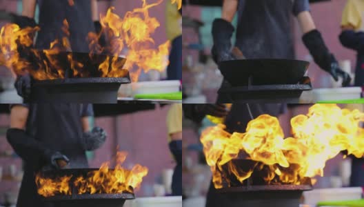 街头食品节。厨师在锅中烧泰国菜高清在线视频素材下载