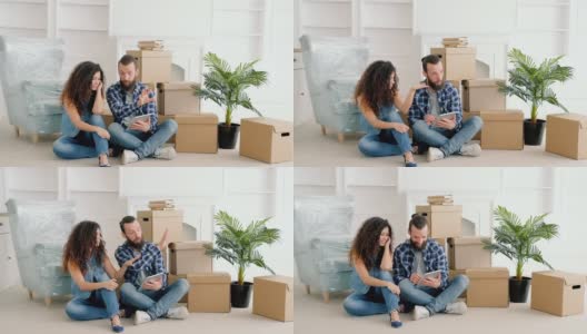 年轻夫妇在网上买新房子的家具高清在线视频素材下载