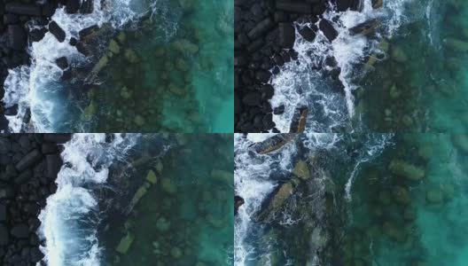 岩石海滩和海浪的鸟瞰图高清在线视频素材下载