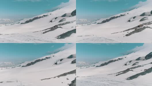 航拍的山坡上覆盖着雪和足迹高清在线视频素材下载