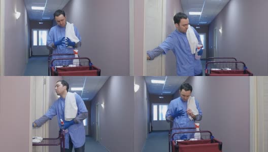 男酒店清洁工在打扫房间前戴上手套高清在线视频素材下载
