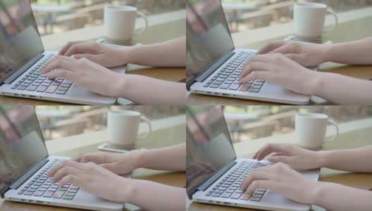 亚洲年轻女子在一个咖啡馆打电话，看着她的笔记本电脑屏幕在她的咖啡休息时间高清在线视频素材下载