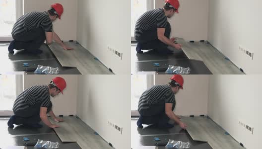 男性建筑商强化地板在新公寓高清在线视频素材下载