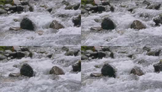 山河在石头上的水流在缓慢的运动，近距离高清在线视频素材下载