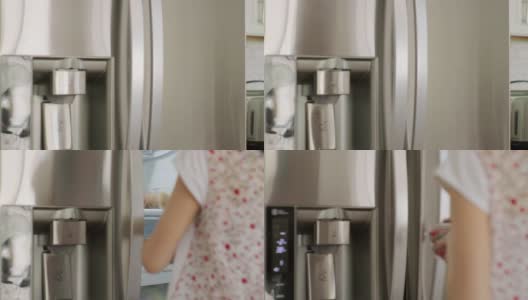 女人打开家用冰箱高清在线视频素材下载