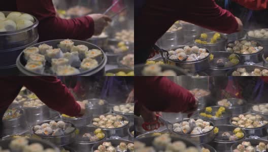 台湾亚洲街食品市场卖饺子和烧卖的4K小贩高清在线视频素材下载