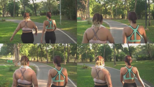 后视图:女性身材高大的运动员和朋友在公园慢跑高清在线视频素材下载