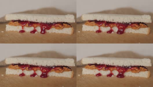 果酱从花生酱和果酱三明治中诱人地渗出来高清在线视频素材下载