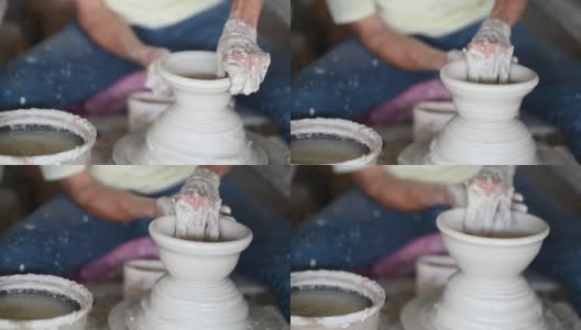 亚洲华人活跃的高级男子波特在他的工作室与纺织陶瓷轮工作高清在线视频素材下载