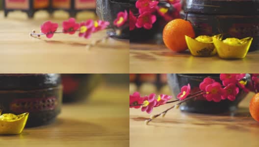中国古代篮子与人造花和春节装饰金元宝高清在线视频素材下载