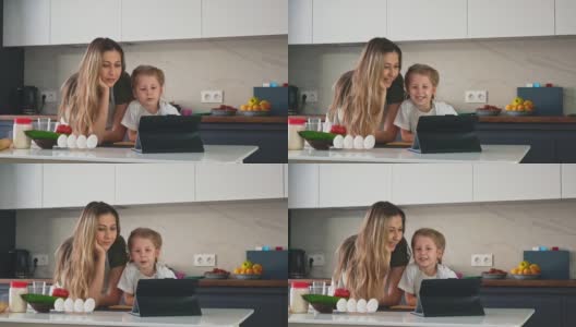 女儿在厨房里跟妈妈商量高清在线视频素材下载