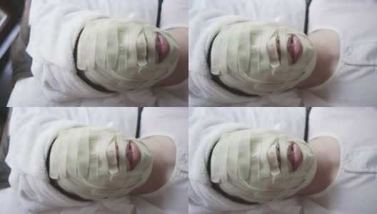 一个女人在水疗中心做面部护理高清在线视频素材下载