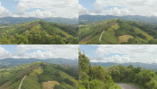 鸟瞰图的乡村道路通过绿色的森林和山高清在线视频素材下载