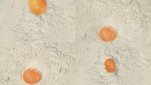 超级慢动作新鲜鸡蛋落入面粉中。用高速摄像机以每秒1000帧的速度拍摄。高清在线视频素材下载