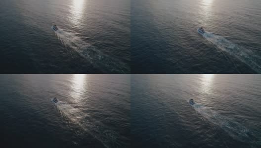 日出时，一艘豪华摩托艇在海上航行。高清在线视频素材下载