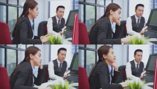 办公室疾病综合症亚洲年轻女商人在电脑前工作时会出现头痛、压力大、不适等症状。她对所分配的工作感到灰心丧气。高清在线视频素材下载