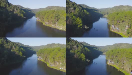 鸟瞰湖边水库露营帐篷区，有森林树木，自然环境景观。庞翁，Mae Hon Son，泰国北部。国家公园。高清在线视频素材下载