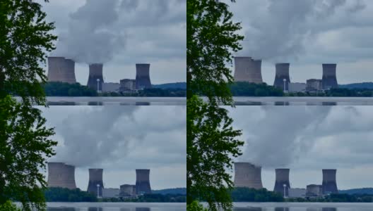 4座核动力冷却塔使天空变暗，时间间隔为4k高清在线视频素材下载