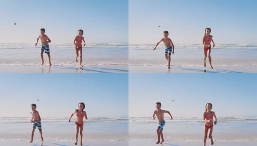 暑假里，男孩和女孩一起沿着海滩奔向照相机高清在线视频素材下载