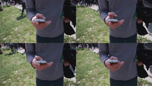 一个年轻人在触摸手机屏幕高清在线视频素材下载