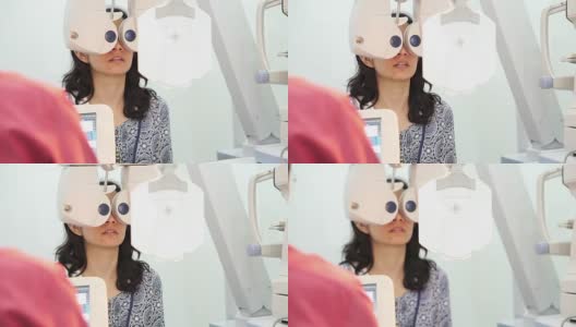 由医生检查视力的亚洲妇女，验光概念高清在线视频素材下载