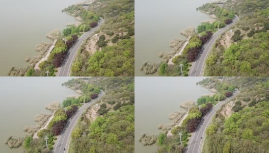 鸟瞰中国的太湖岸线和蜿蜒的高速公路高清在线视频素材下载