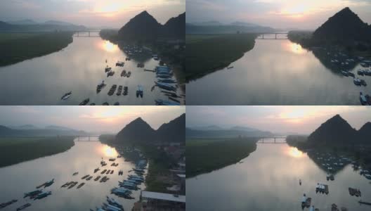 飞行摄像机拍摄的是河水倒映的完美日落高清在线视频素材下载