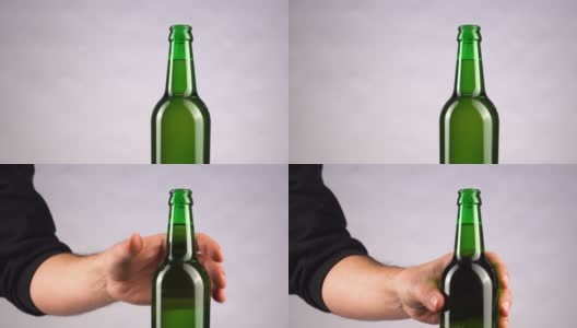 男人喝冰镇啤酒的背景。用手把冷藏的小麦或啤酒从架子上拿出来高清在线视频素材下载