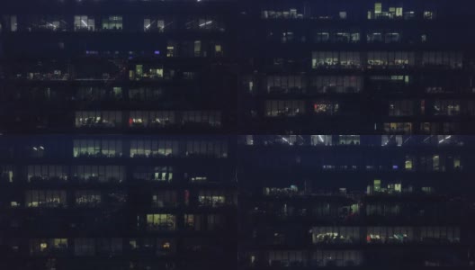 鸟瞰图办公室窗户的摩天大楼晚上高清在线视频素材下载