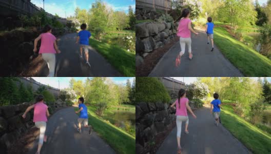 两个孩子在湖边的小路上跑步高清在线视频素材下载