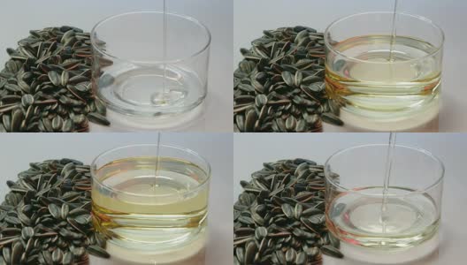 将葵花籽并排放入量杯中，倒入葵花籽油。高清在线视频素材下载