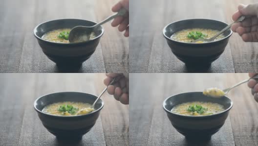 用勺子舀米粥高清在线视频素材下载