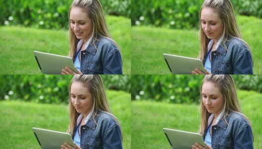 一个开心的金发女人在用平板电脑高清在线视频素材下载