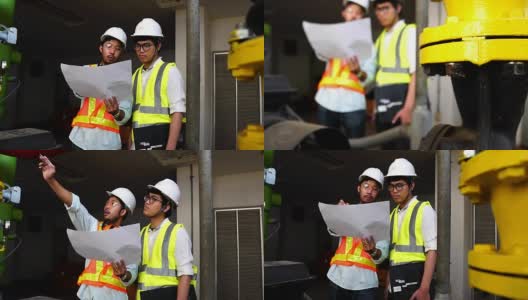 慢镜头:两名亚洲工程师正在检查工厂的电气系统高清在线视频素材下载