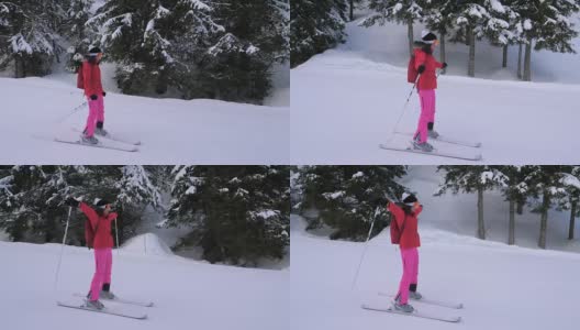 一名女子在松树林中的山坡上滑雪高清在线视频素材下载