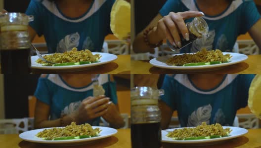 餐馆里的女孩倒酱油和米饭吃高清在线视频素材下载