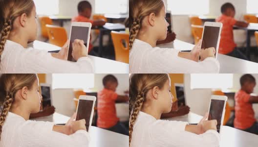 女生在教室里使用平板电脑高清在线视频素材下载