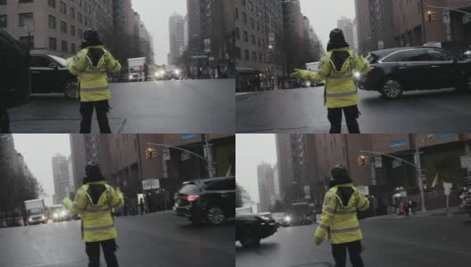 交通管理员在城市街道上引导汽车高清在线视频素材下载