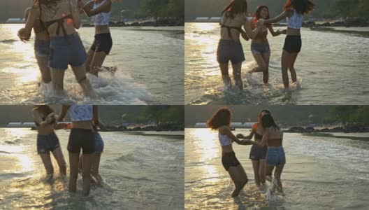 在阳光明媚的早晨，穿着比基尼的妇女们沿着海滩和大海跳舞。高清在线视频素材下载