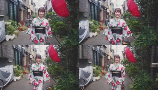 年轻女子在日本传统的狭窄街道上行走高清在线视频素材下载