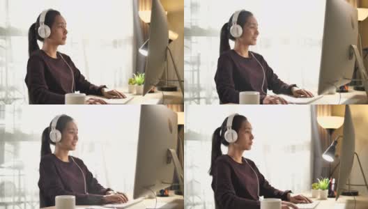 亚洲妇女在家里用电脑工作高清在线视频素材下载