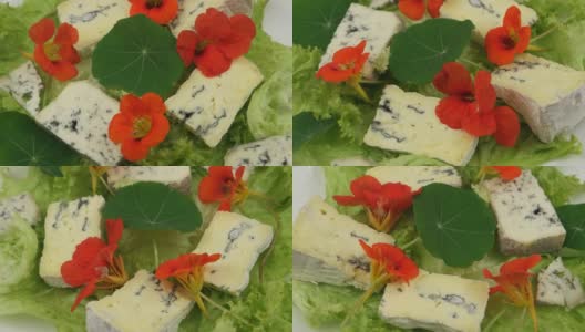 莴苣叶，蓝奶酪和可食用的旱金莲花高清在线视频素材下载