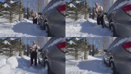 一个阳光明媚的冬日，一名50岁的白人男子正在用铲子清理他停在车道上的车。加速timelapse-style视频高清在线视频素材下载