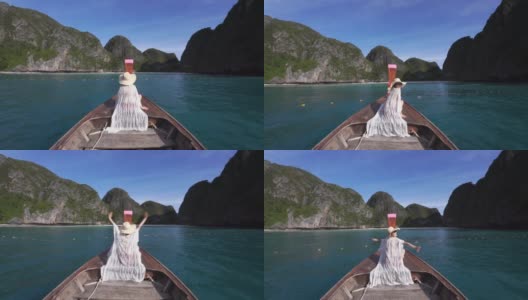 慢动作场景后视图亚洲妇女在热带岛屿乘船旅行，在泰国的皮皮利岛乘船旅行高清在线视频素材下载