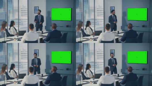 多元化办公室会议室会议:男项目经理利用绿屏色度键墙电视为集团投资者呈现机会。电子商务产品策略。中宽静态镜头高清在线视频素材下载