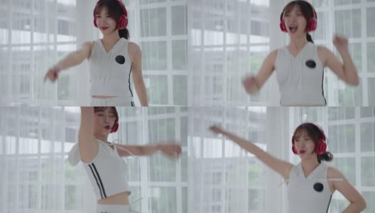一个美丽的亚洲女人在房间里练习跳舞，欢快而快乐。高清在线视频素材下载