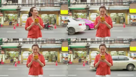 在泰国曼谷的夜市，4K亚洲女性正在使用智能手机旅行高清在线视频素材下载