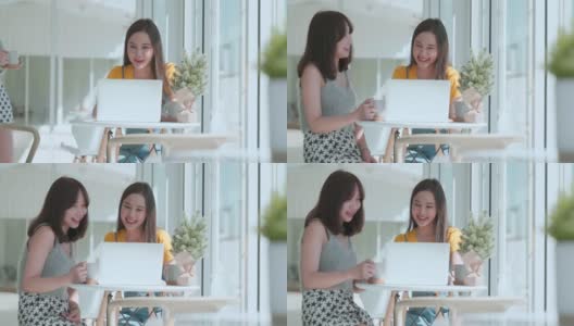 有吸引力的亚洲女性谈论好的积极的谈话与朋友微笑大笑和幸福时刻在柜台附近的窗口在咖啡馆从花园阳光积极的态度关系高清在线视频素材下载